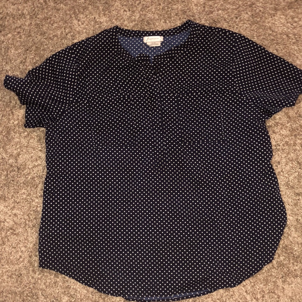 Blue and white polka dot shirt.